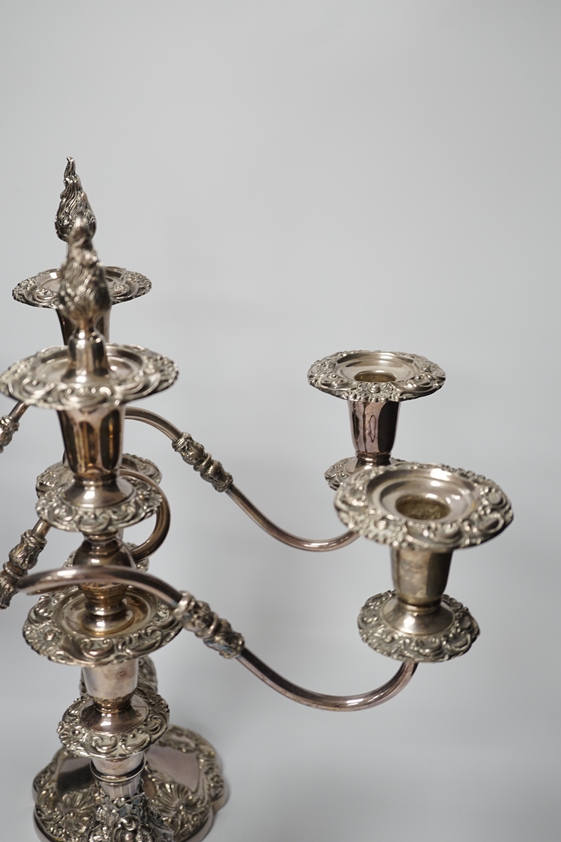 Two silver plated two branch three light candelabra, 49cm high